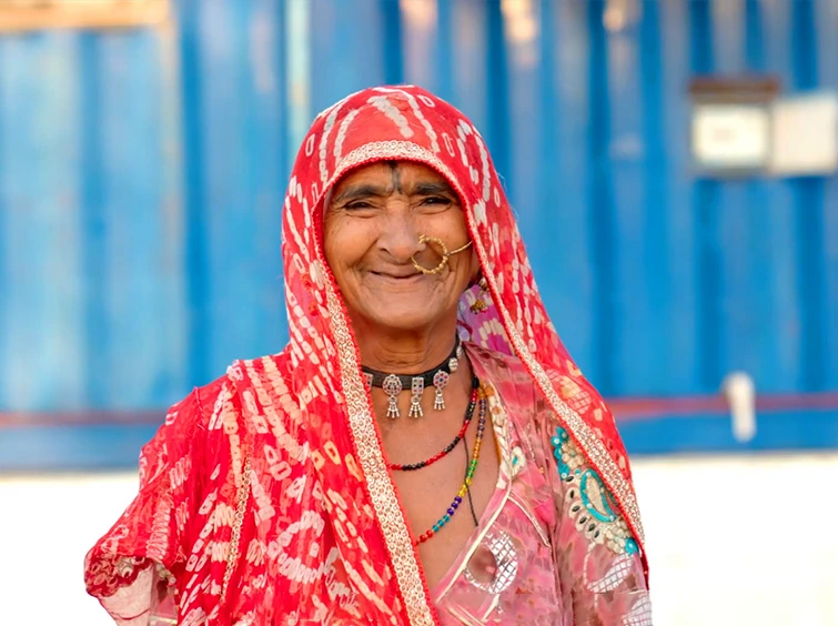 An Indian woman radiates energy in a red sari.